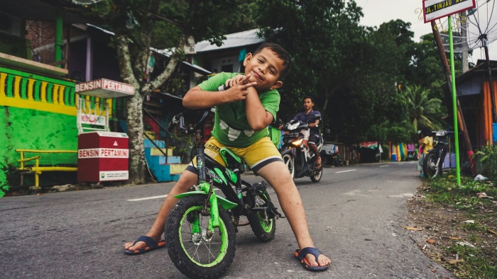 a boy want to ride a bike